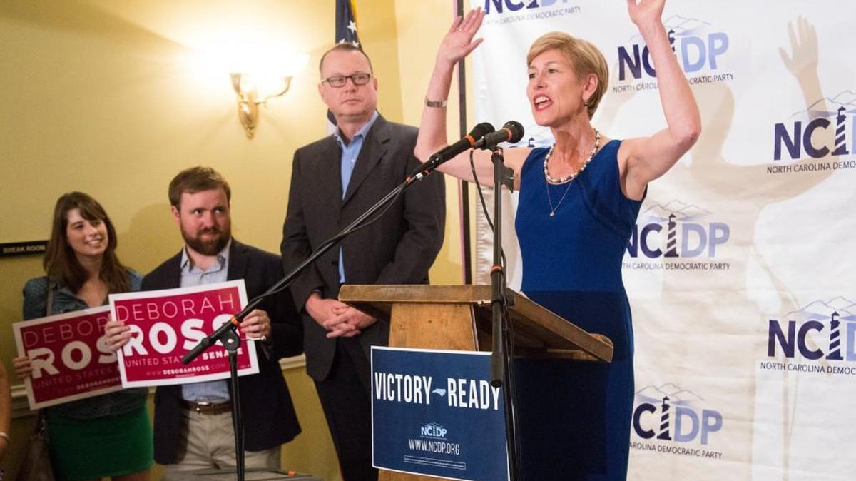 Democratic US Senate nominee Deborah Ross thanks supporters as her husband Steve Wrinn looks on as she makes her primary election victory speech during a primary election night party Tuesday, March 15, 2016 at the North Carolina Democratic Party headquarters in Raleigh.