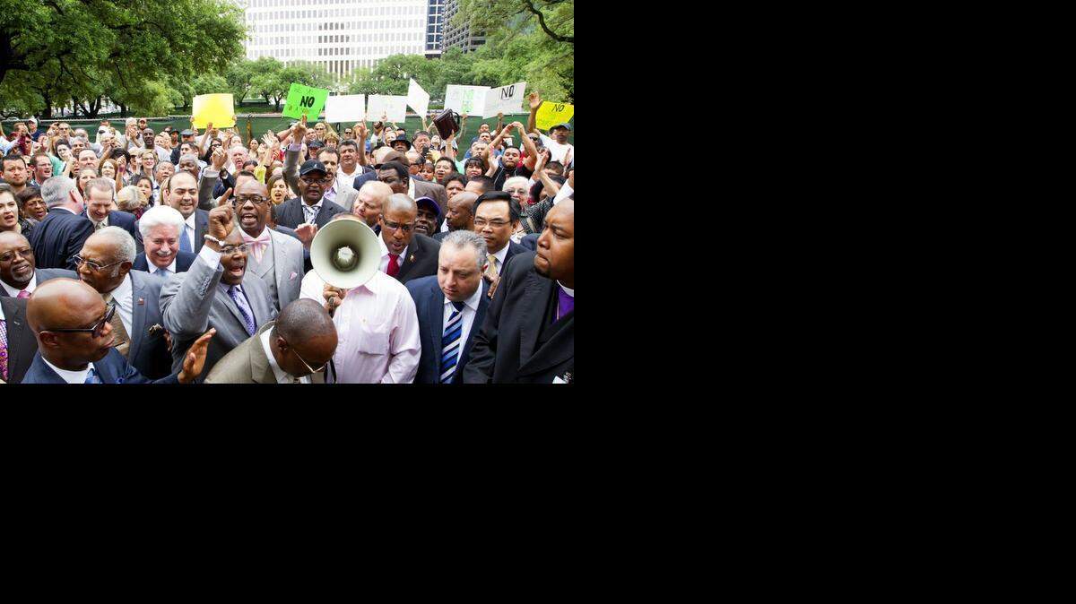 
Protesters gather outside Houston’s City Hall after Mayor Annise Parker and supporters of her proposed nondiscrimination ordinance announced a compromise in May 2014.
