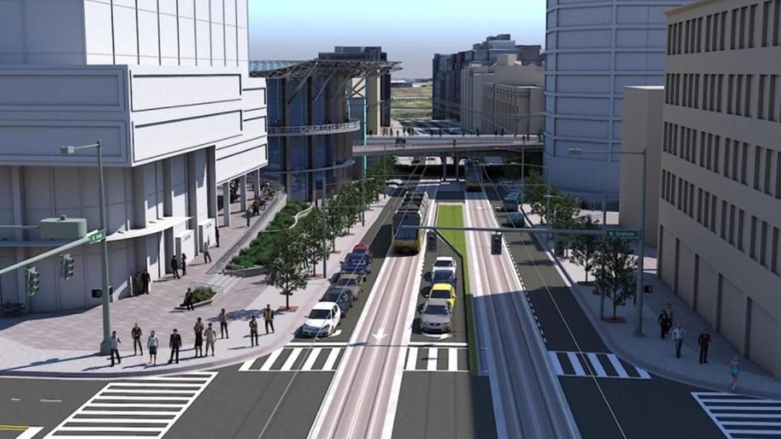 This is a rendering of Charlotte’s Gateway Station (on the left) from Trade Street. The Gold Line streetcar is in Trade Street, and the Amtrak line would cross Trade Street by a bridge.
