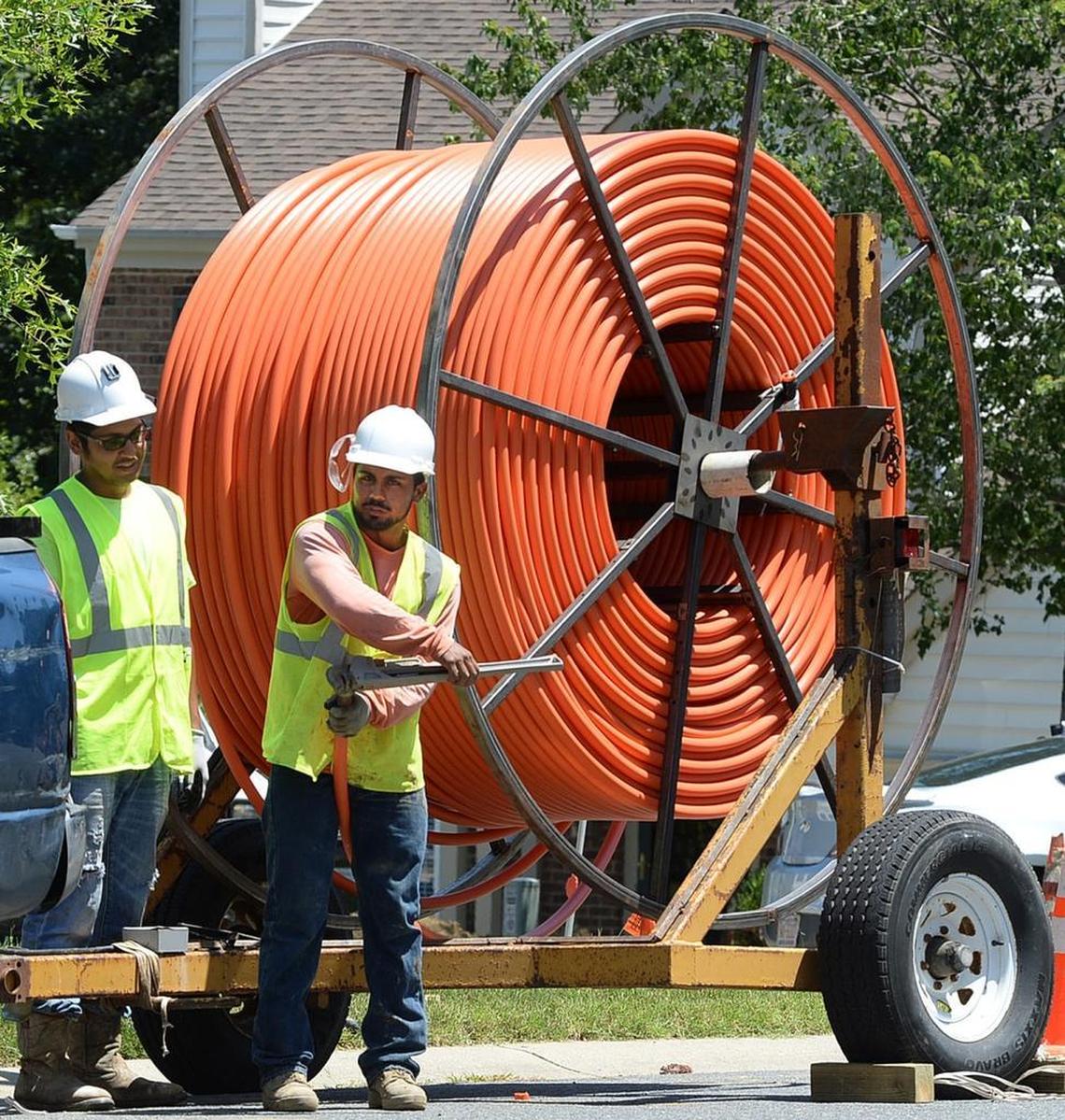 Contractors doing work installing fiber optic cable lines for Google Fiber in 2015.