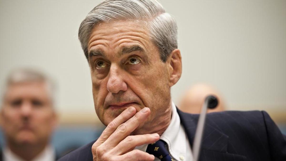 In this 2012 file photo, then-FBI Director Robert Mueller listens as he testifies on Capitol Hill in Washington.