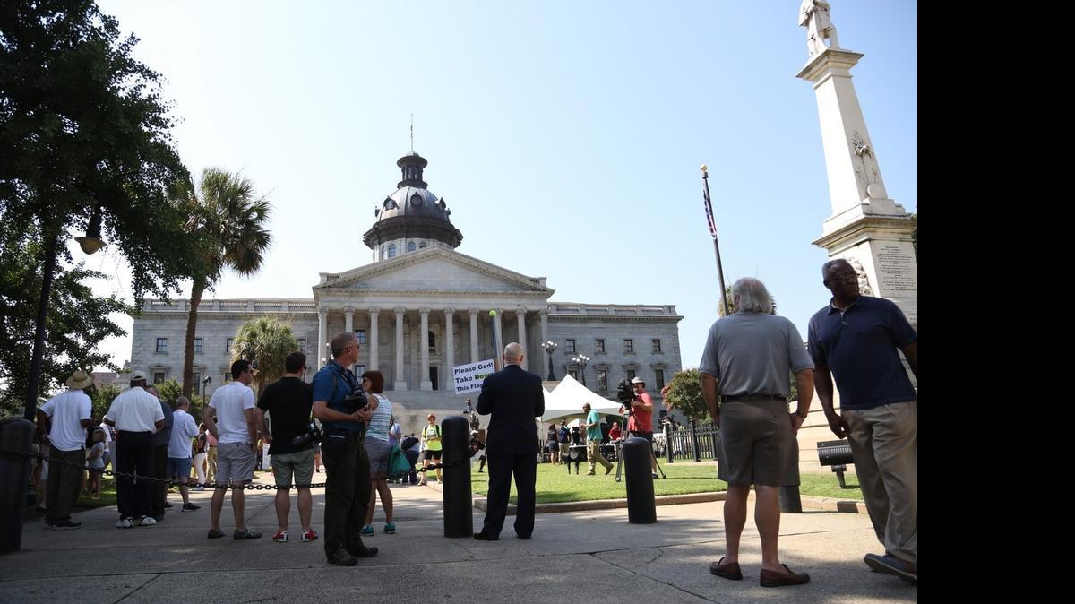 
People gather for the start of Tuesday’s rally at the State House.
