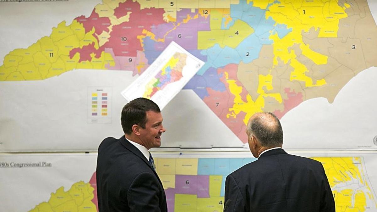 Two of North Carolina’s Republican state senators review historical redistricting maps in 2016. Detailed numbers from the 2020 Census were released last week, allowing North Carolina to start redrawing political maps. Republicans will lead the process this year because they hold the majority in the N.C. General Assembly.