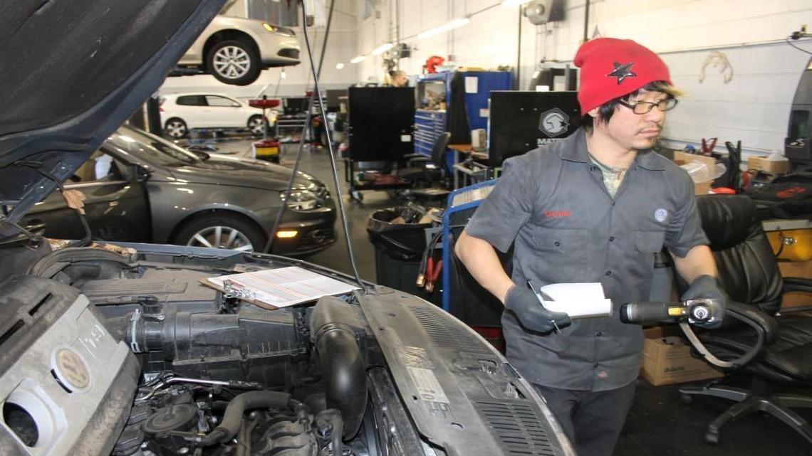 
Auto mechanic Deven Lee works on cars at Leith Volkswagen in Cary. The legislature’s budget bill would add sales tax to labor charges at automotive shops.
