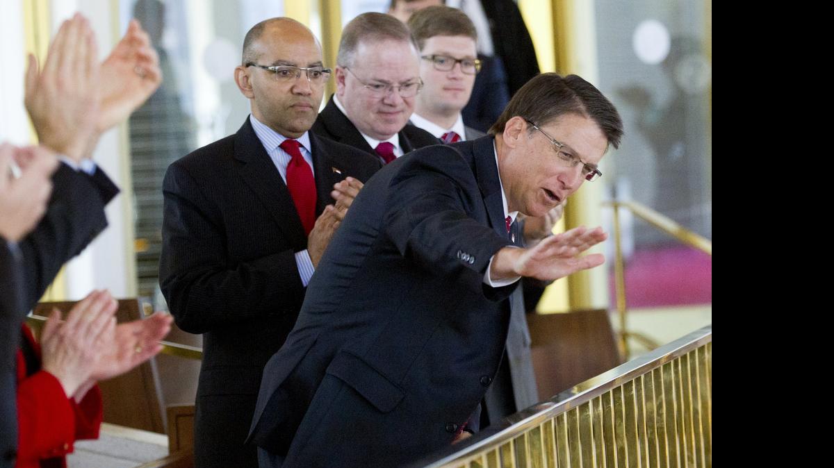 
Gov. Pat McCrory (R) waves from the gallery after he was recognized during the N.C. Senate session at the Legislature in Raleigh on Jan. 28, 2015. Earlier, a group organized by the N.C. NAACP was in the building protesting the policies of the Republican-led lawmakers.
