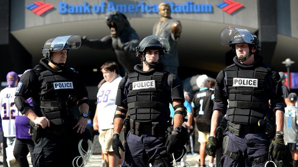 Charlotte-Mecklenburg police in riot gear guard an entrance area at Bank of America Stadium in Charlotte, NC on Sunday, September 25, 2016. That game was deemed an Extraordinary Event by the city. Under a new proposal, the Extraordinary Events ordinance would be repealed and replaced.
