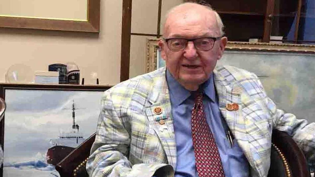 File Photo: Rep. Howard Coble in his former congressional office in Washington, D.C. A painting of a Coast Guard icebreaker he served on as a young man leans against the wall beside him.