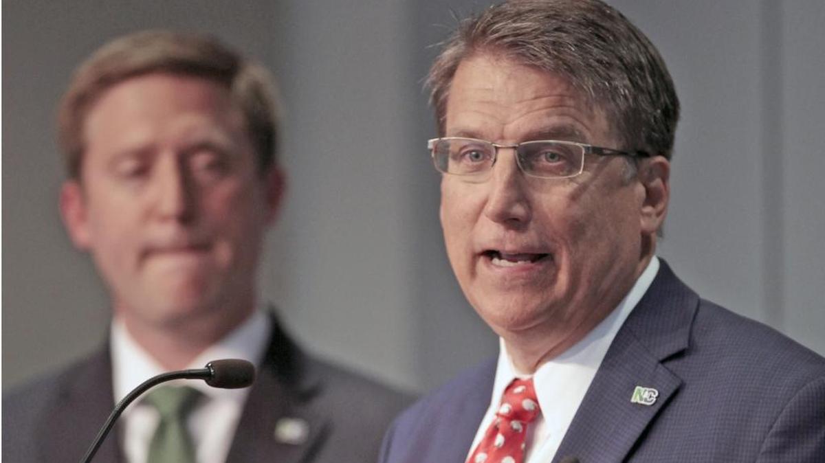 From left, state budget director Andrew Heath listens as N.C. Gov Pat McCrory gives overall details of the 2016-17 state budget during a press conference Friday in Raleigh.