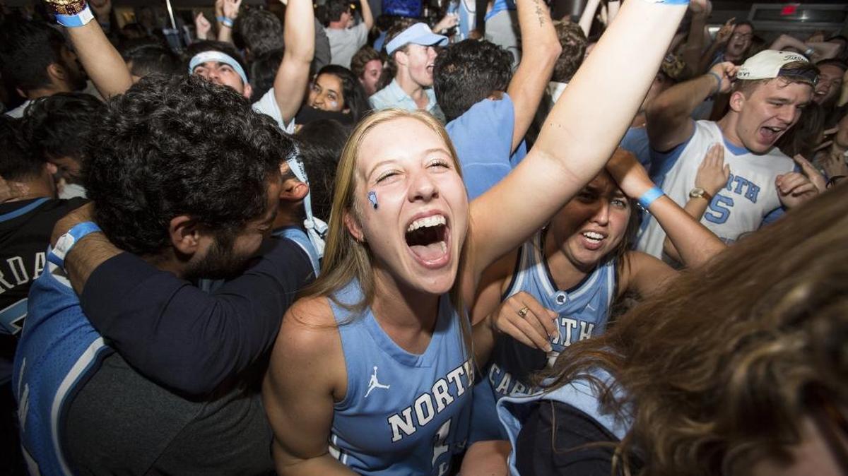 Maribeth Bloncheck, middle, celebrates with other Tar Heel fans at Top Of The Hill restaurant as North Carolina defeated Gonzaga to win the NCAA Basketball Championship in Chapel Hill, N.C., Monday, Apr. 3, 2017