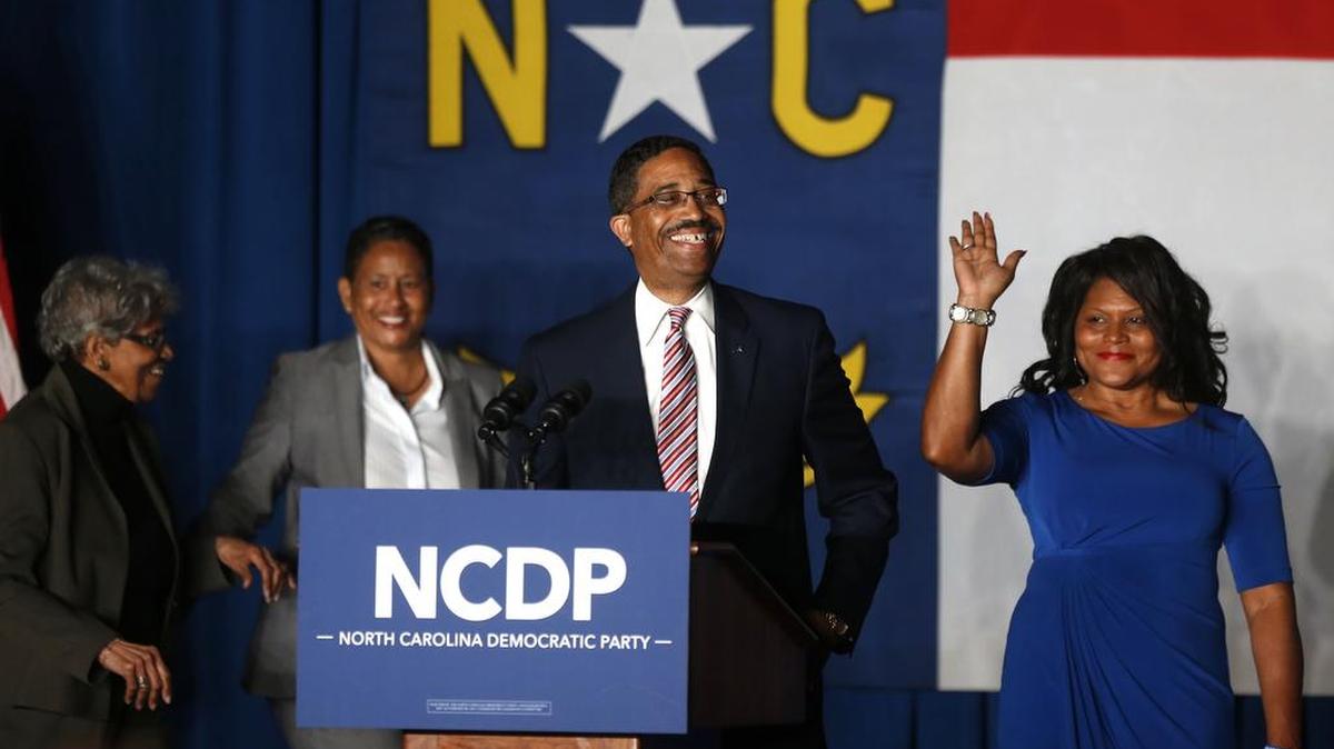 Judge Mike Morgan smiles as he takes the stage during an election party hosted by the North Carolina Democratic Party at the Raleigh Marriott City Center in downtown Raleigh, N.C., Tuesday, Nov. 8, 2016.