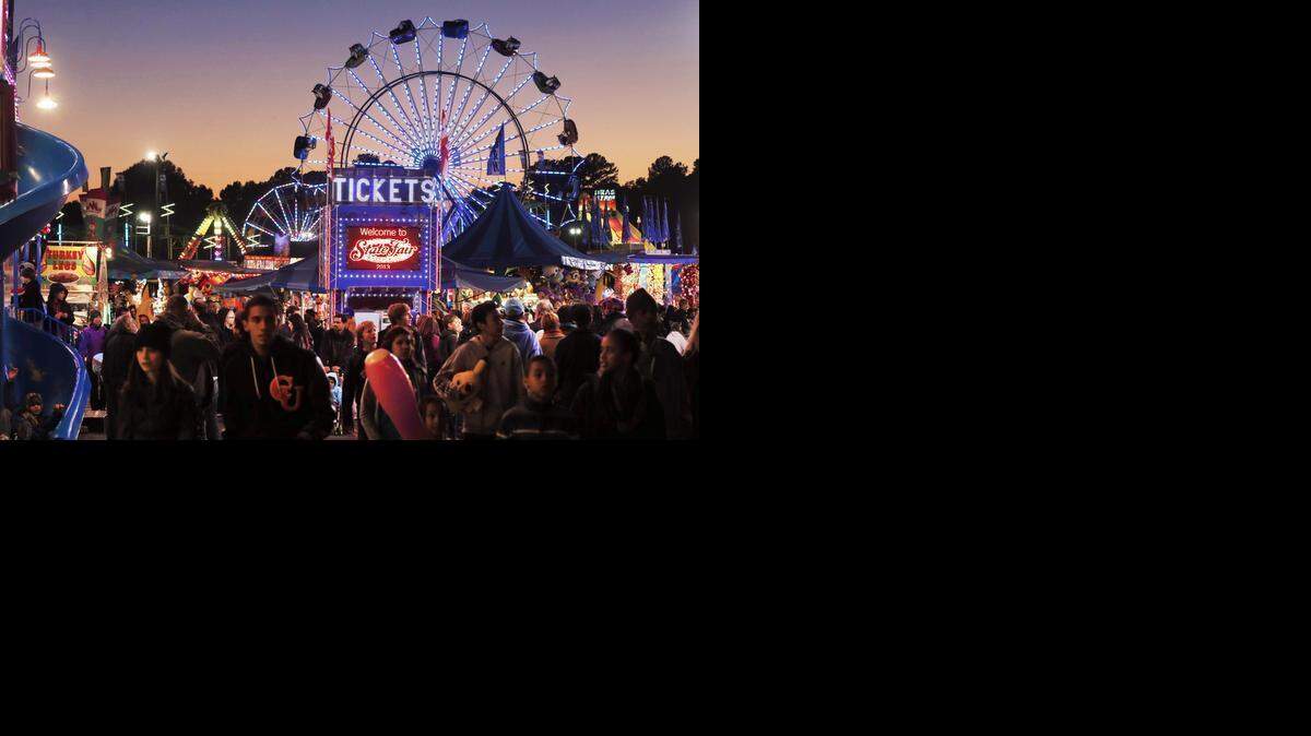 
FILE PHOTO, October 2013: The sun sets during the N.C. State Fair in Raleigh.
