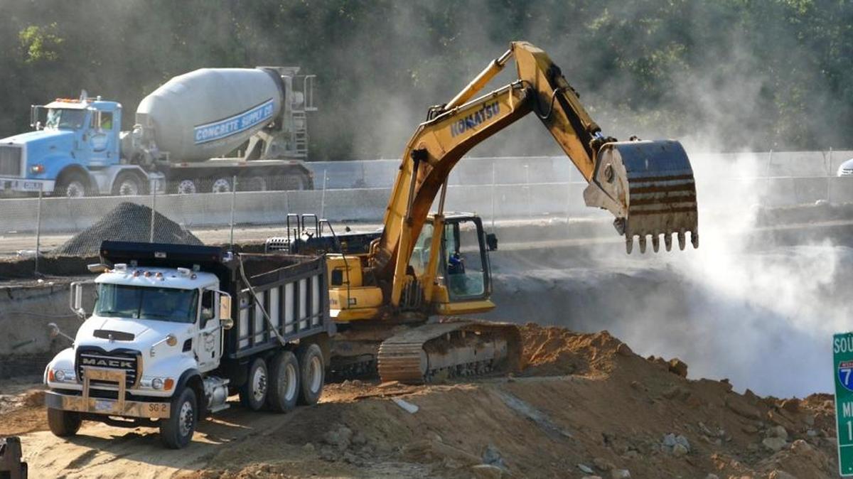 Work continues in the Interstate 77 toll lane construction zone as seen hear near the Interstate 85 and Interstate 77 merge area north of Charlotte, in July. The N.C. Department of Transportation is forming a study group of representatives from local governments and chambers of commerce to review the project.