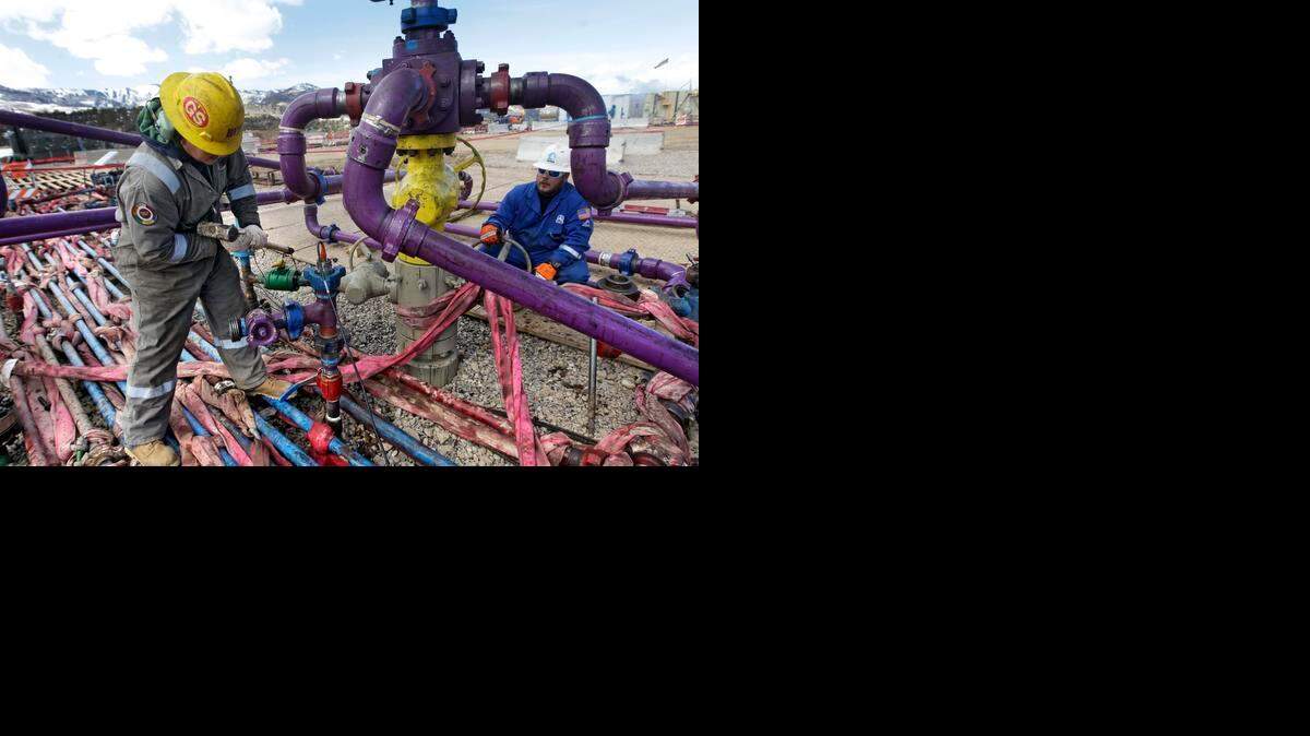 
Workers tend to a well head during a hydraulic fracturing operation  in western Colorado in 2013. On Tuesday, North Carolina becomes the nation’s 34th state to allow such fracking operations to mine natural gas.
