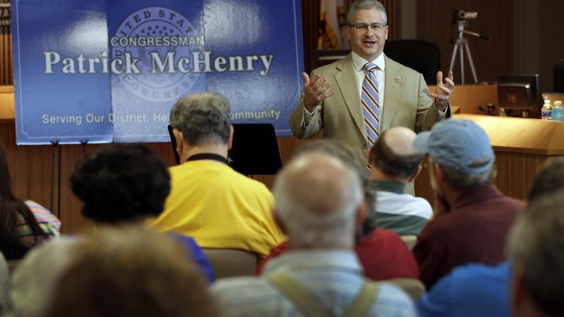 In this photo taken Aug. 5, 2013, Rep. Patrick McHenry speaks to a full house during a town hall meeting in Lincolnton, N.C.