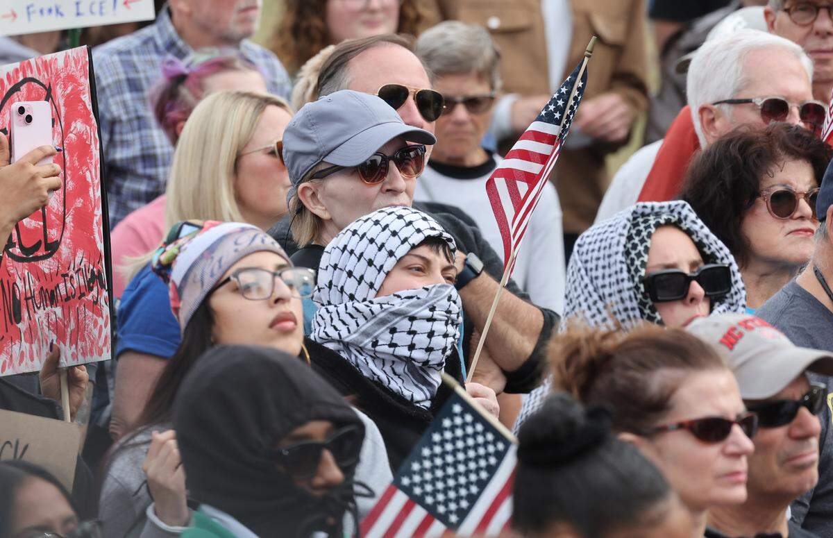Protesters gather in uptown Charlotte Saturday to protest federal agents arrested people in the city.