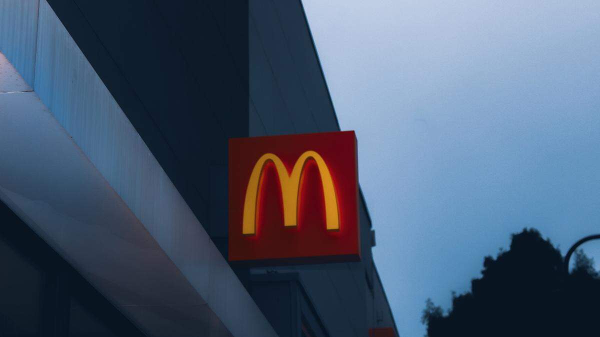 A McDonald’s worker is charged with second-degree murder after a woman was shot to death inside a North Carolina restaurant, police said.