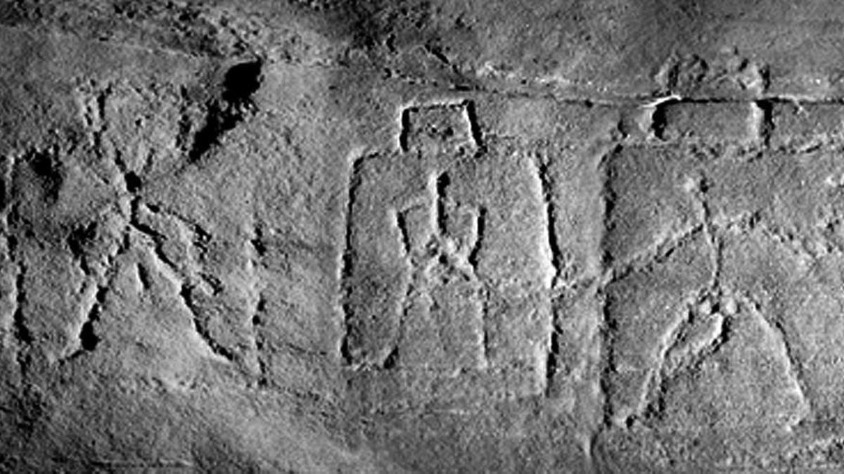 Unknown hand-carved stick figures representing humans are on a rock at Hagood Creek Petroglyph Site.