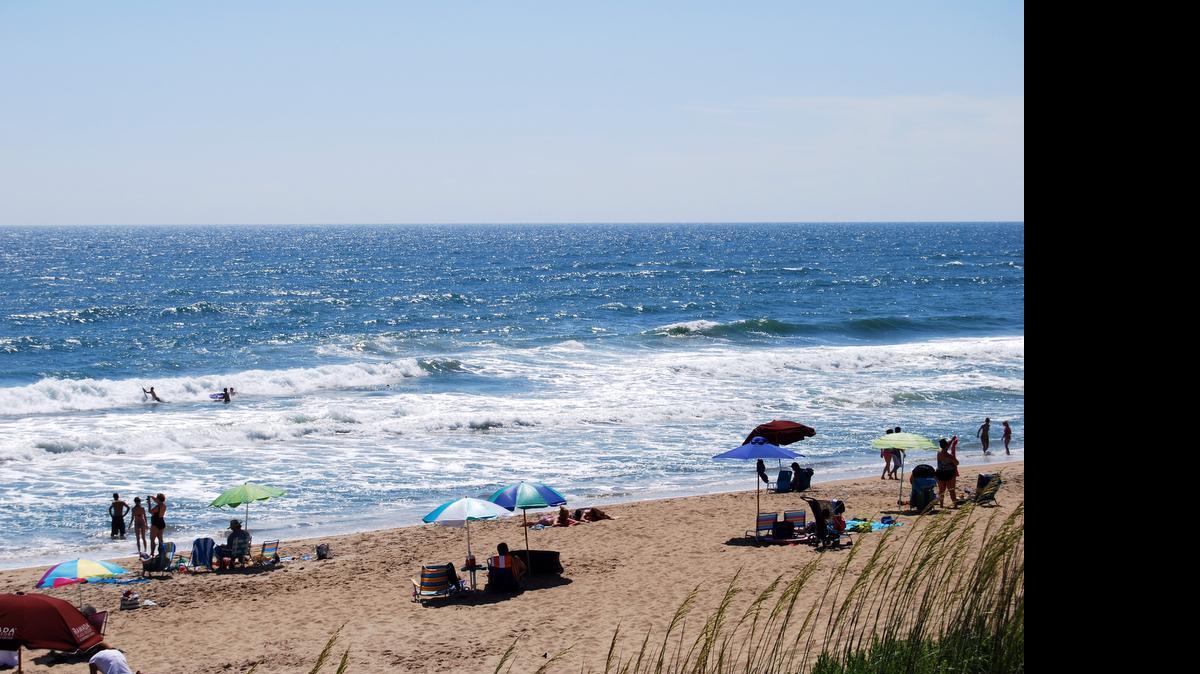 
Rip currents – like this one at Kill Devil Hills – are difficult to spot for the average beachgoer. Here, the foam in the flat spot between the breaking waves rides the rip current off-shore.
