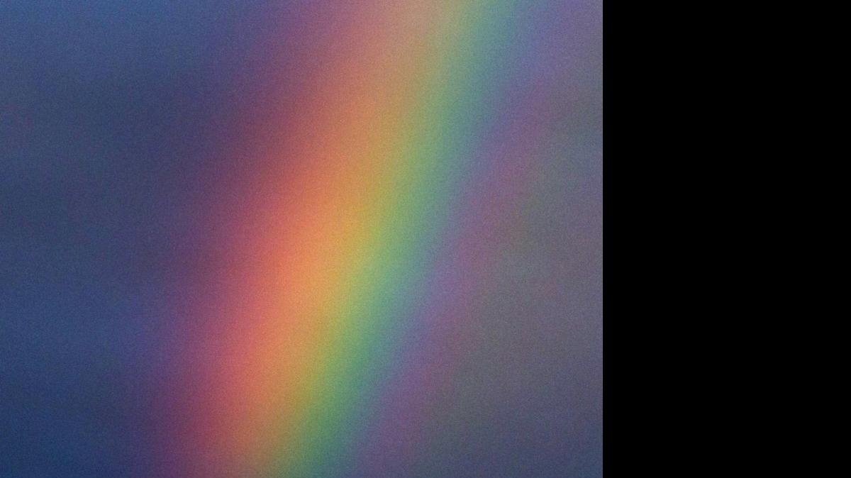 
An Air China jet flies past a rainbow over Beijing in 2014. 
