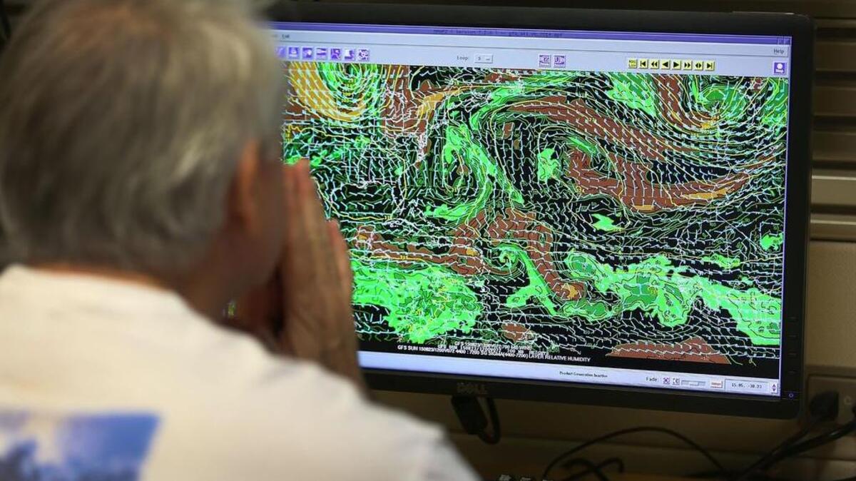 
A specialist at the National Hurricane Center, in Miami, tracks Hurricane Danny on a computer screen as it becomes the first of the 2015 Atlantic hurricane season on Aug. 20.

