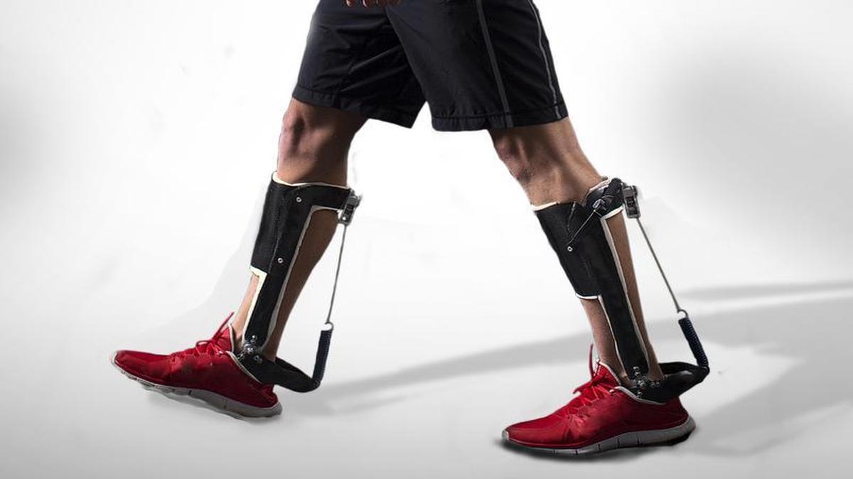 
The add-on exoskeleton in action: The energy required for walking on a treadmill dropped 7 percent when the walker wore it. 
