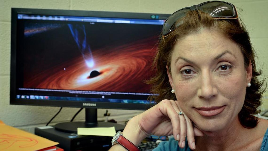 Laura Mersini-Houghton in her office at UNC-Chapel Hill: In late August, Mersini-Houghton was among the international physicists who gathered in Stockholm, Sweden, to sort out the tangle of theories about black holes.