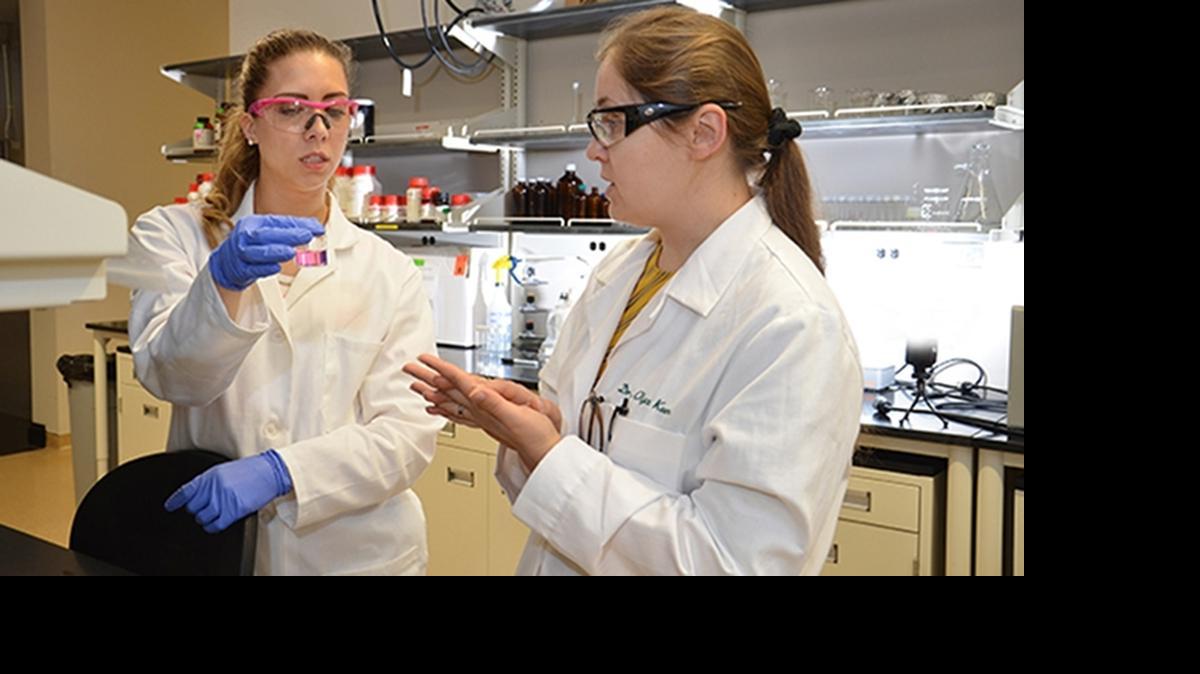 
UNCC engineering professor Olya Keen, right, works with doctoral student Nicole Kennedy-Neth on a lab sample.
