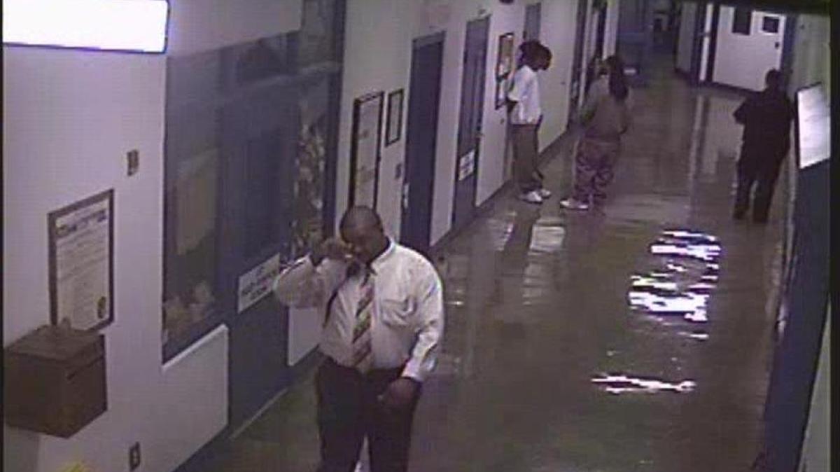 Former Lanesboro Correctional Institution manager Jeffery Wall walks down a prison hallway in 2012.