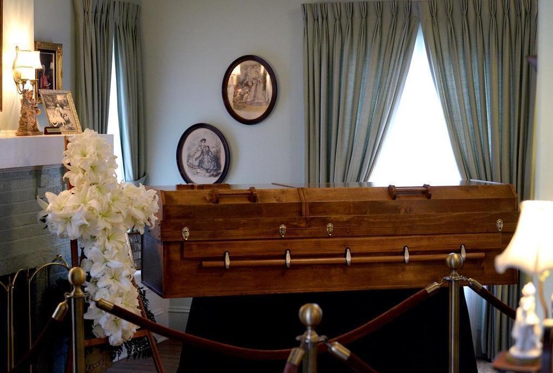 The closed casket of Billy Graham lies in repose in his childhood home on Charlotte's Billy Graham Evangelistic Association property.