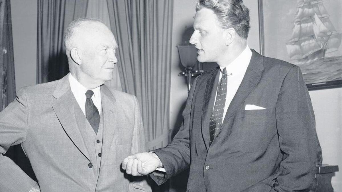 President Dwight Eisenhower and Billy Graham talk at the White House in 1957.