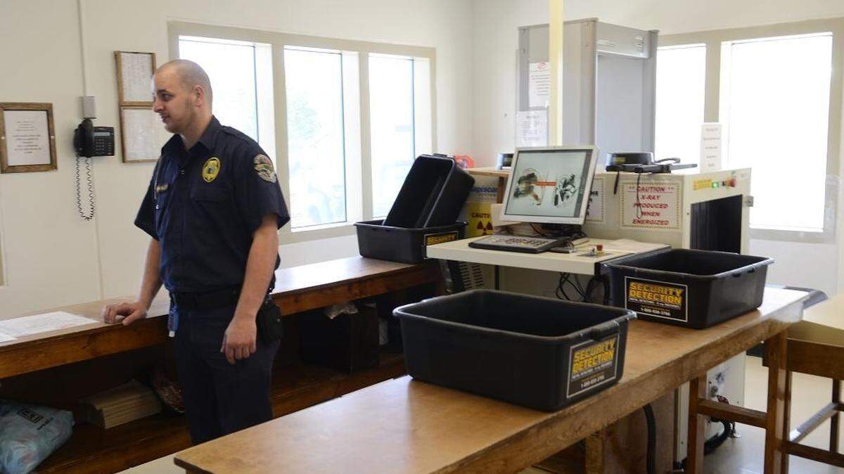 A correctional officer at Lanesboro Correctional Institution, in Polkton, works in the prison’s gatehouse, where employees report to work each day. Employees smuggle in most of the contraband that finds its way into North Carolina’s maximum-security prisons, the Observer found.
