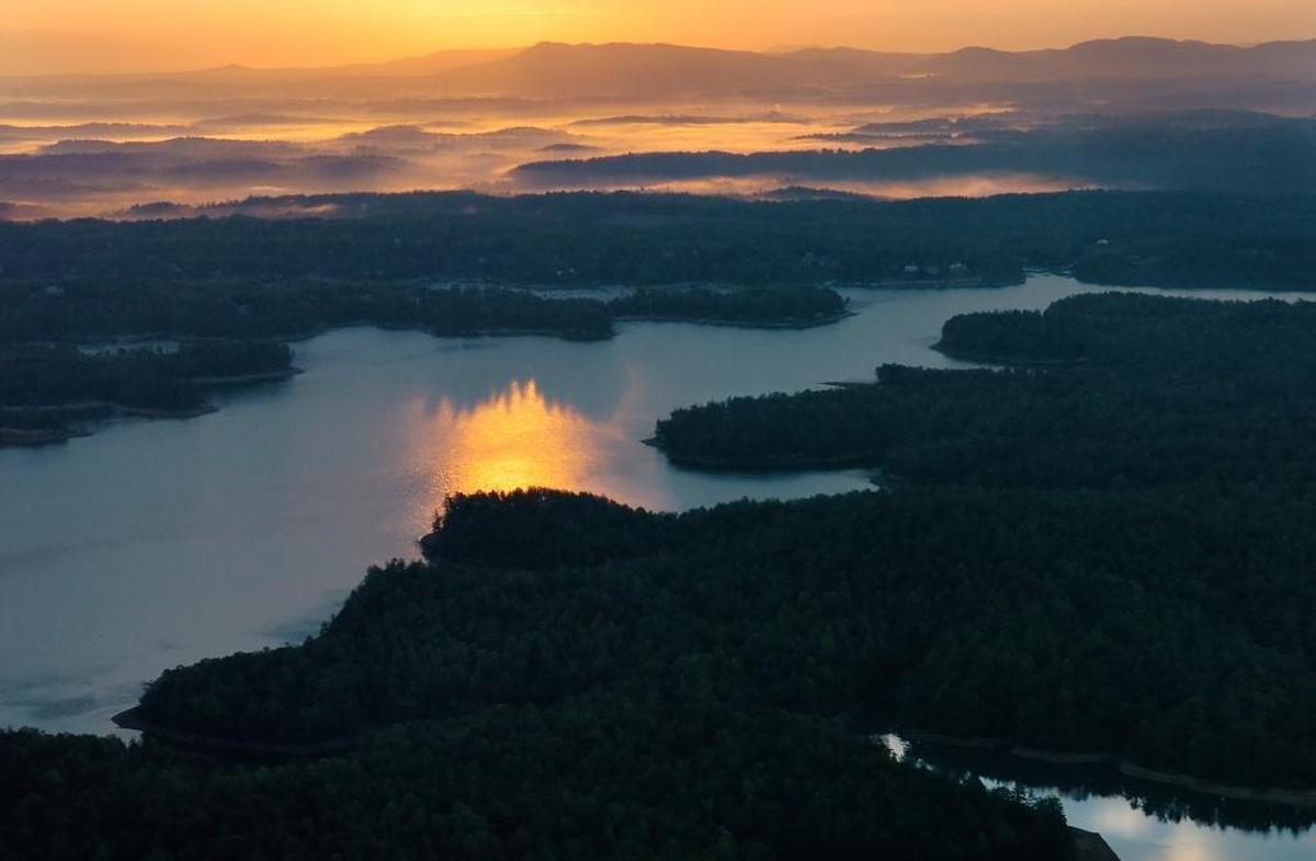 Lake James is known as one of the most beautiful lakes on the east coast. The sun ignites fog in the valleys near the lake in this Charlotte Observer file photo.