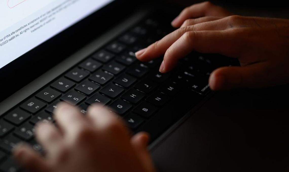  In this photo illustration, a teenage child looks at a screen of age-restricted content on a laptop screen on January 17, 2023 in London, England. 