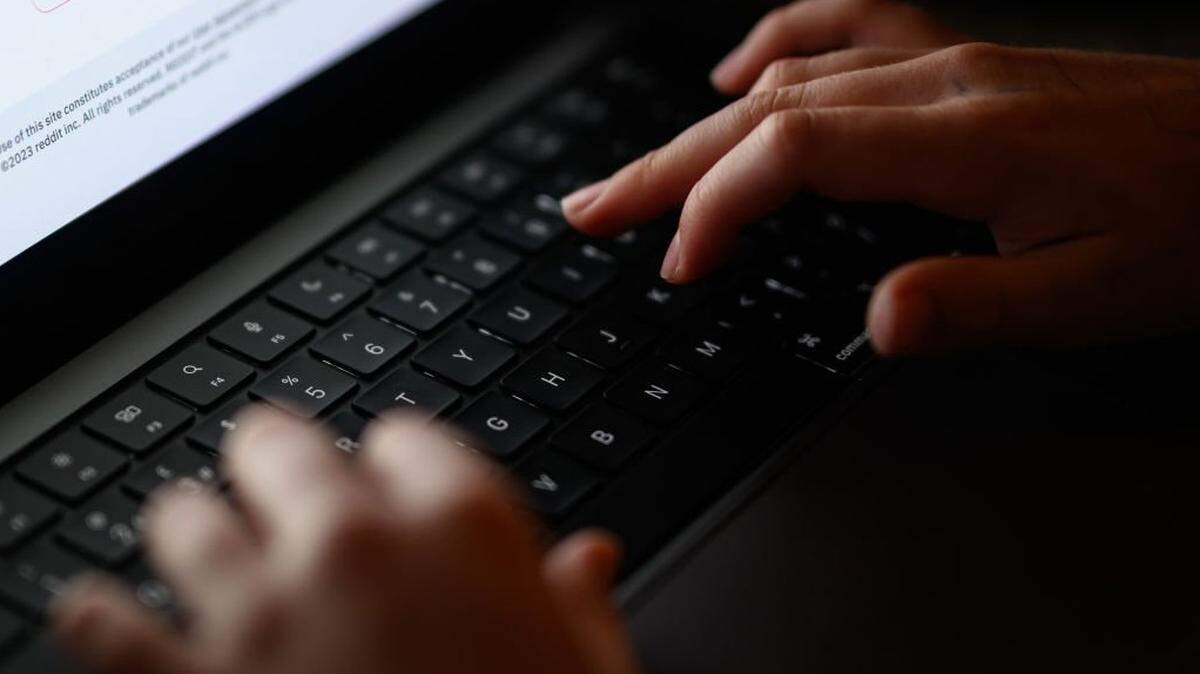 LONDON, ENGLAND - JANUARY 17: In this photo illustration, a teenage child looks at a screen of age-restricted content on a laptop screen on January 17, 2023 in London, England. The Bill aims to protect young and vulnerable viewers by introducing new rules for social media companies which host user-generated content, and for search engines, which will have tailored duties focussed on minimising the presentation of harmful search results. Content that platforms will need to remove includes child sexual abuse material, revenge pornography, selling illegal drugs or weapons, and terrorism. (Photo by Leon Neal/Getty Images)