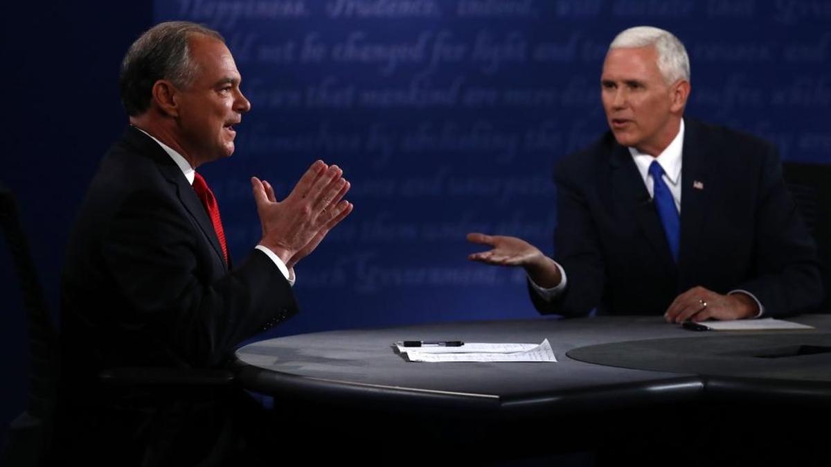 Tim Kaine, 2016 Democratic vice presidential nominee, left, and Mike Pence, 2016 Republican vice presidential nominee, speak Tuesday during the vice presidential debate at Longwood University in Farmville, Va.