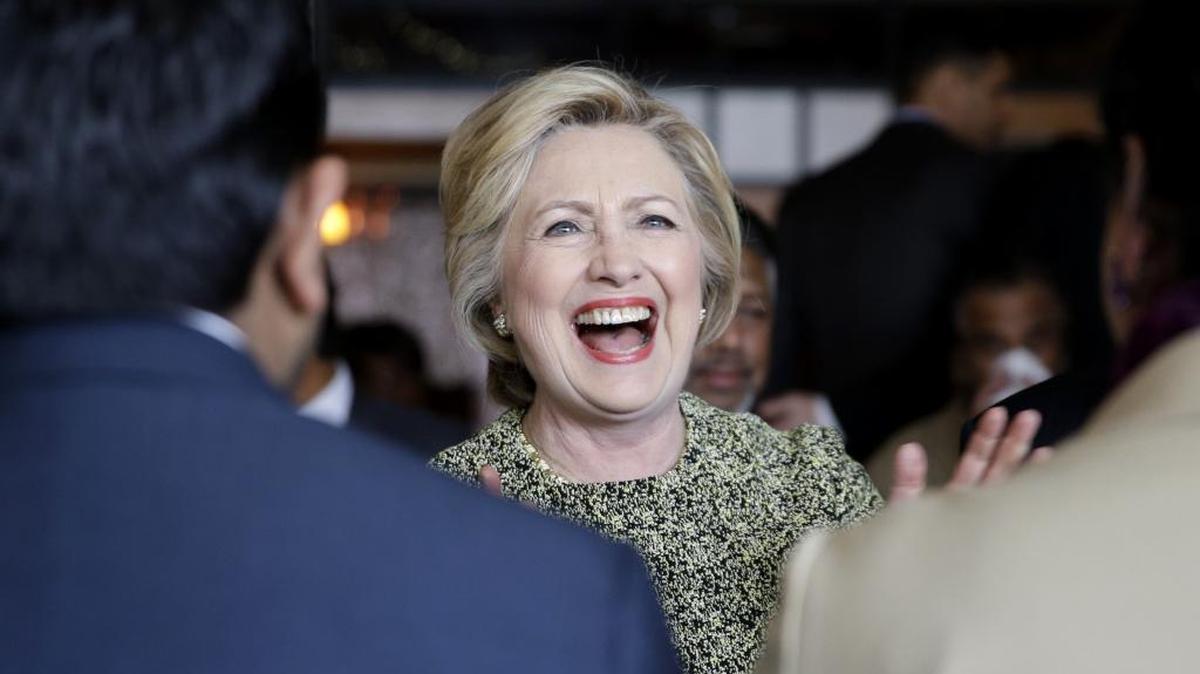 Democratic presidential hopeful Hillary Clinton talks to community leaders and politicians Monday at the Jackson Diner in New York.