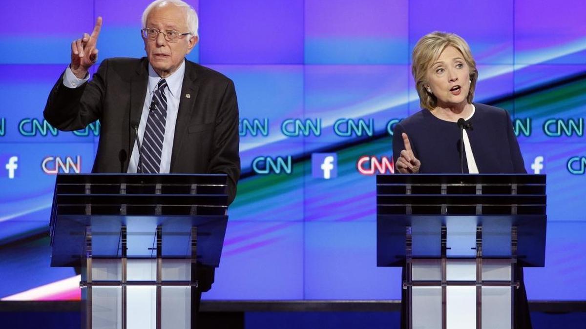 
Hillary Rodham Clinton, right, and Sen. Bernie Sanders, of Vermont, speak during the CNN Democratic presidential debate Tuesday.
