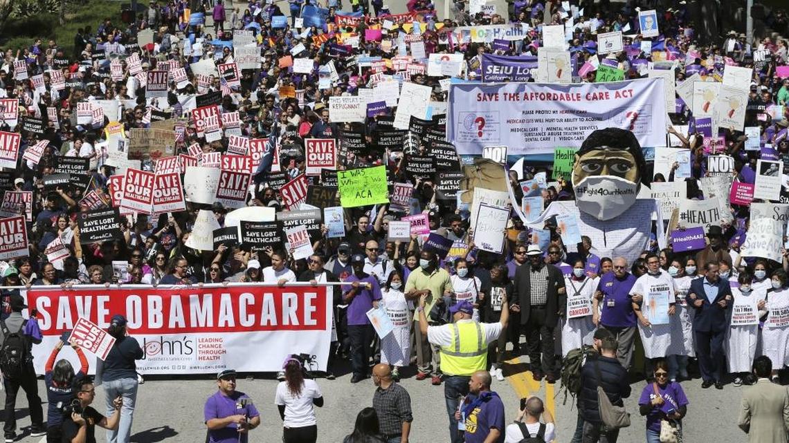 Hundreds of people march in California last month to protest President Donald Trump's plan to dismantle the Affordable Care Act.