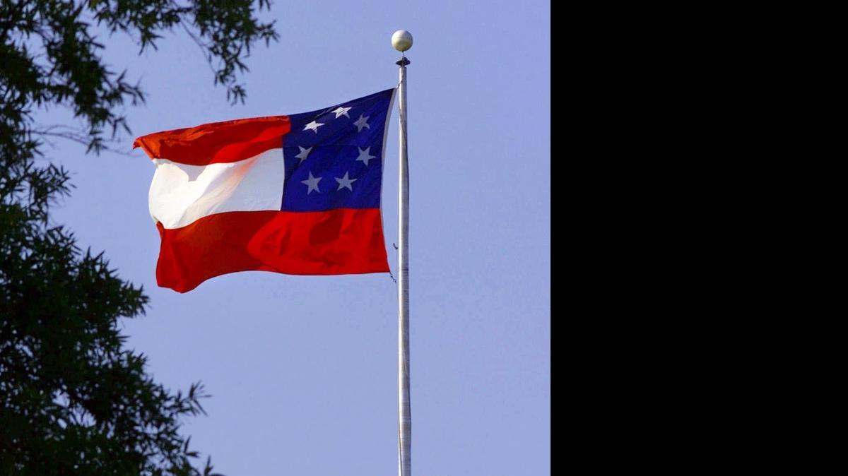 
The Confederacy’s first national flag flies over the state Capitol.
