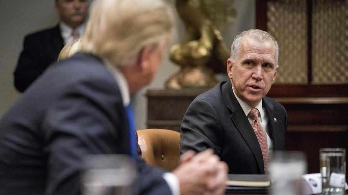 President Donald Trump listens as Sen. Thom Tillis, R-N.C. speaks during a meeting last week with Republican Senators on immigration in the Roosevelt Room in the White House.