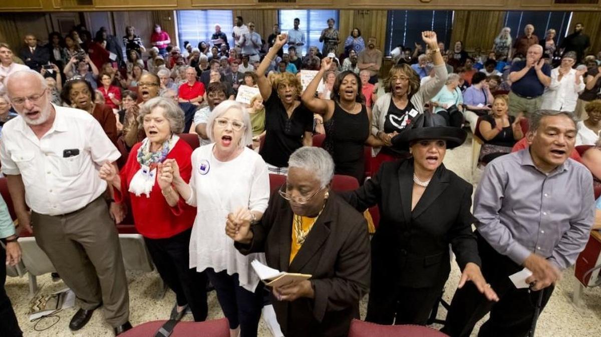 A raucous crowd of 300 people packed the Guilford County Board of Elections meeting last week to fight a proposal to cut nearly a dozen early voting sites.