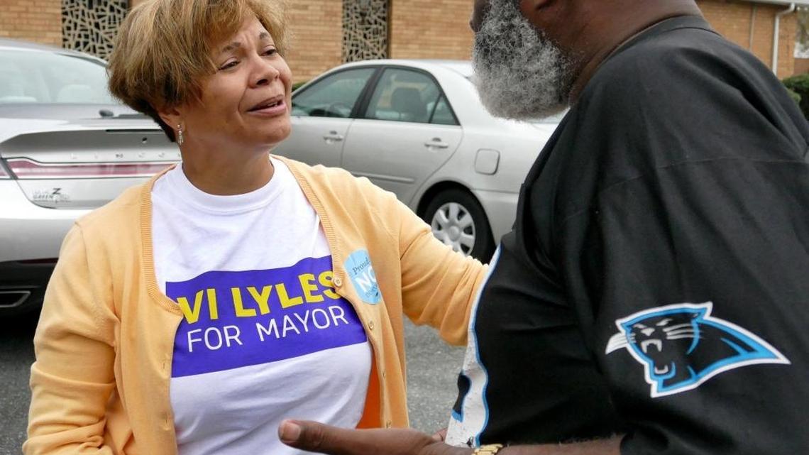 Democrat Vi Lyles greets a voter Tuesday morning. She becomes Charlotte’s first black female mayor.