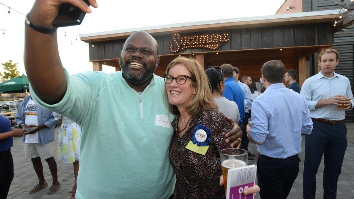 Ray McKinnon takes a selfie with City Council at Large candidate Julie Eiselt at an event last month in Charlotte.