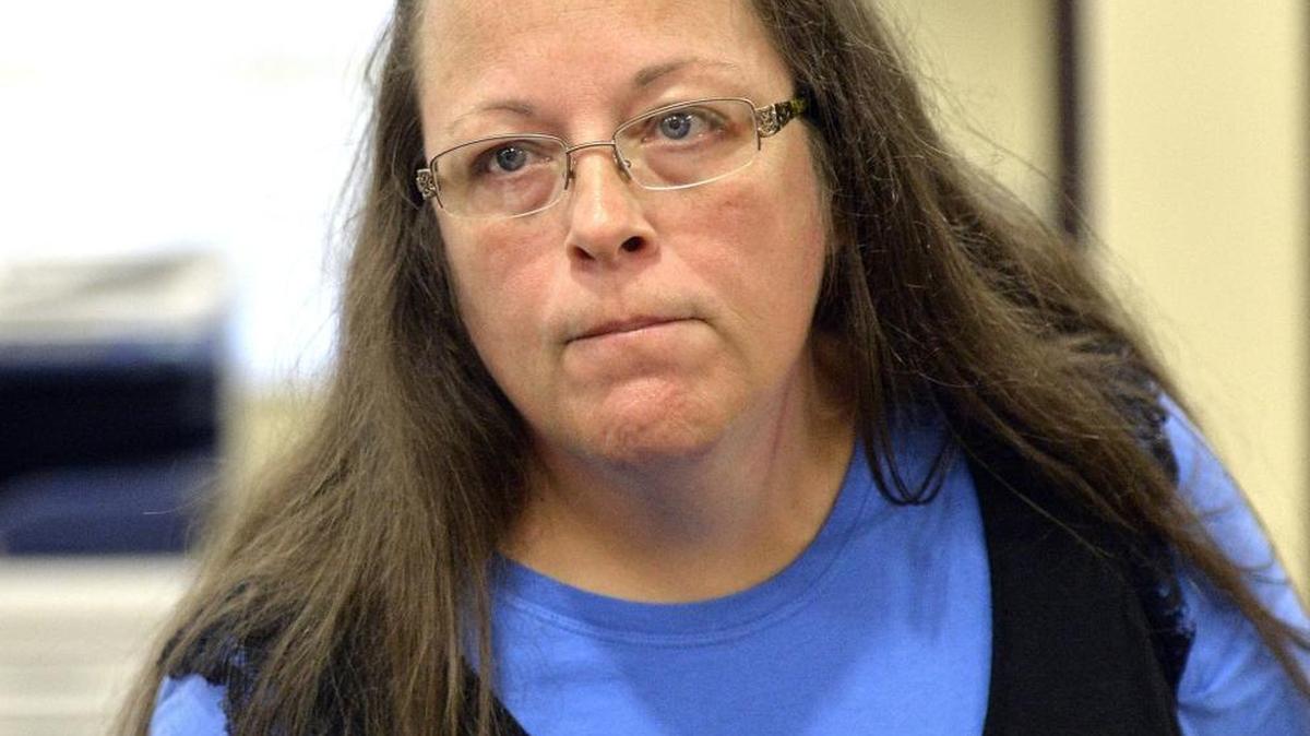 
County Clerk Kim Davis listens to a customer following her refusal to issue marriage licenses on Tuesday.  
