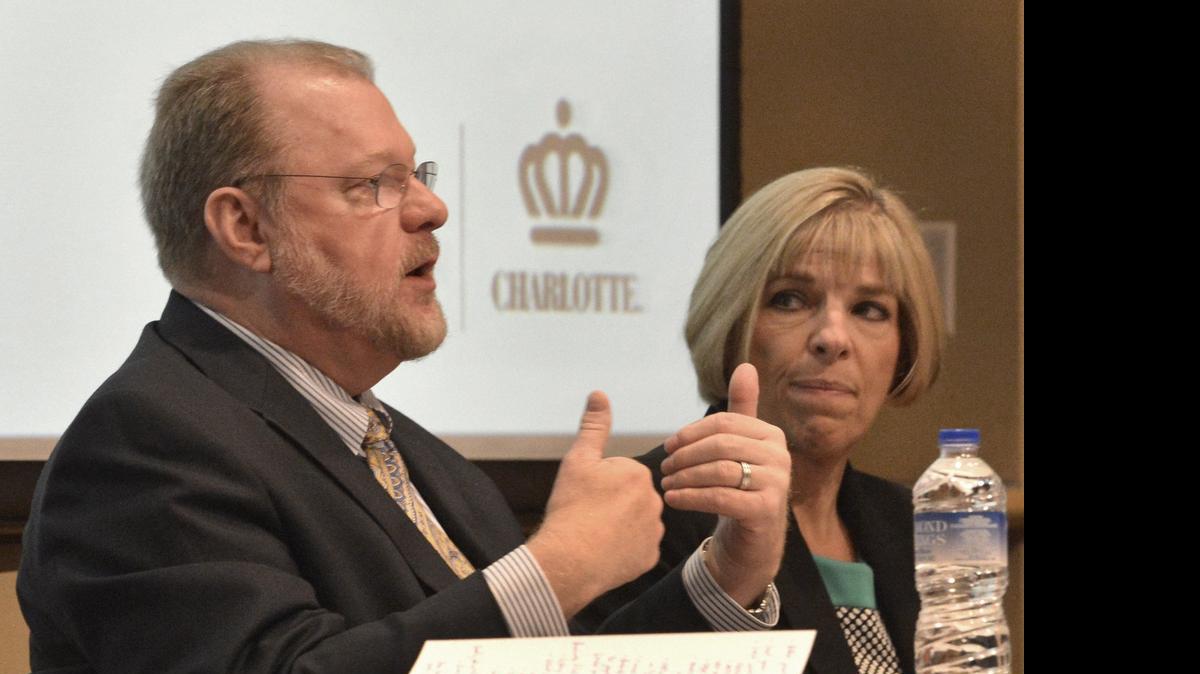 
City Manager Ron Carlee and County Manager Dena Diorio discuss a Charlotte Chamber report on the city’s business climate last year. 

