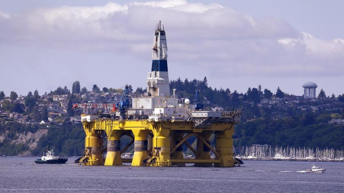 In this May 14, 2015 file photo, the oil drilling rig Polar Pioneer is towed toward a dock in Elliott Bay in Seattle. (AP Photo/Elaine Thompson, File)