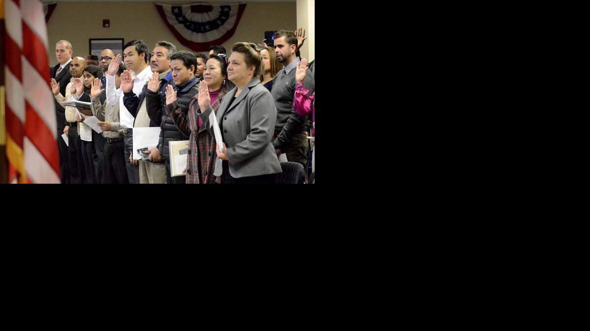 
Immigrants, including these becoming citizens in December, are transforming Charlotte.
