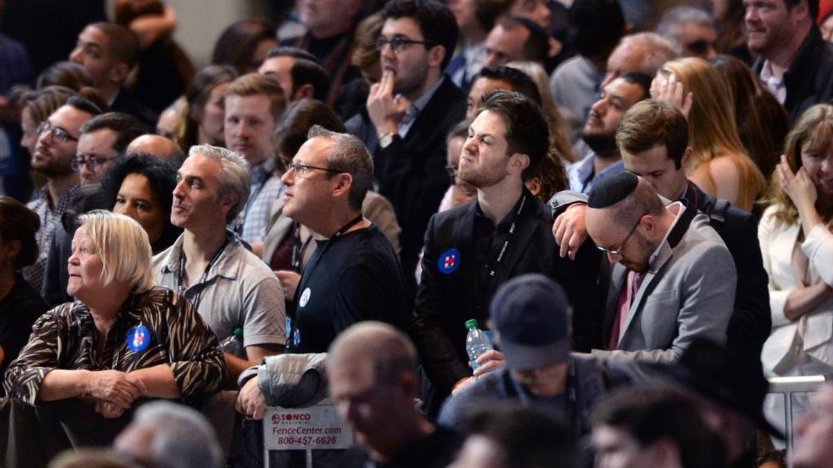 Supporters of Democratic presidential nominee Hillary Clinton react to early results Tuesday in New York.