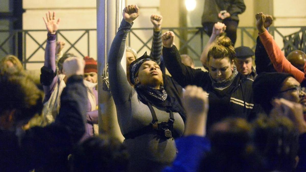 Protesters hold a moment of silence for Keith Lamont Scott in November after the officer who shot him was cleared.