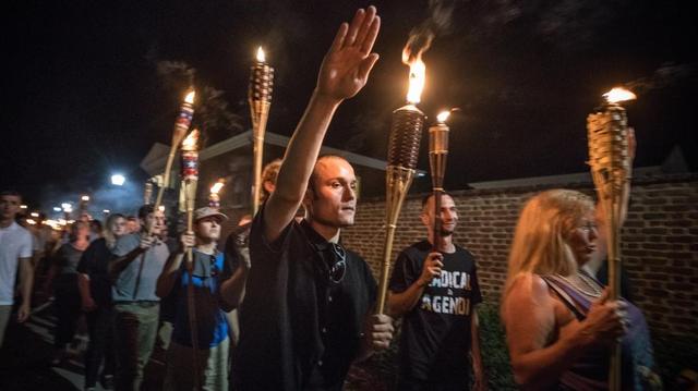 Chanting “Jews will not replace us!” several hundred white nationalists and white supremacists carrying torches marched in a parade through the University of Virginia campus on Aug. 11.